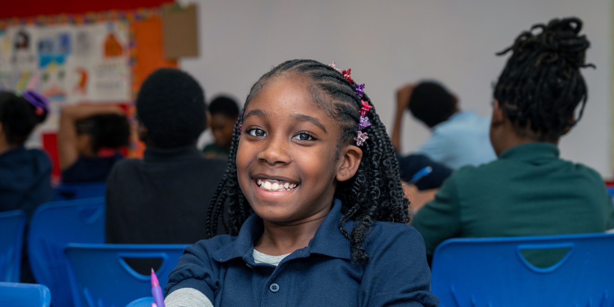 Smiling student sitting at table